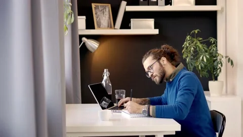 Freelancer drawing while sitting in the home office. Stock Footage 141375392