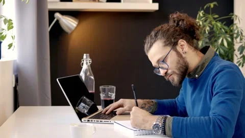 Freelancer drawing while sitting in the home office. Stock Footage 141375539