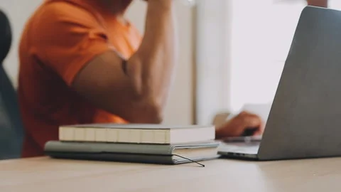 Freelancer drinking water sitting at table Stock Footage 252499631