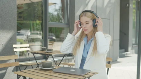 Freelancer Ending Work Session And Taking Off Headphones At Outdoor Cafe 스톡 동영상 313839307