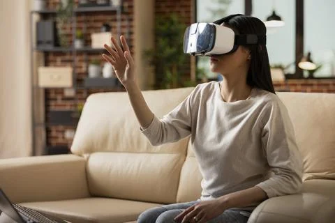 Freelancer exploring immersive tech with vr headset Stock Photos