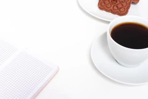 Freelancer future plan with a cup of coffee, chocolate cookies and diary on a Stock Photos