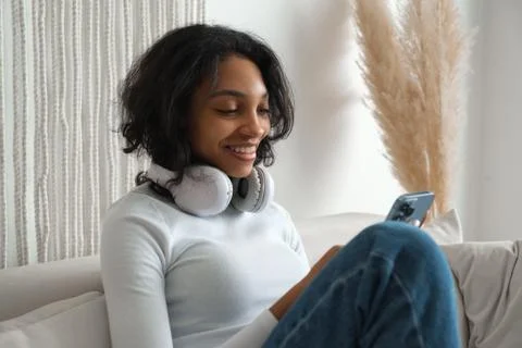 Freelancer gitl works at home using smarphone. Modern technologies Stock Photos