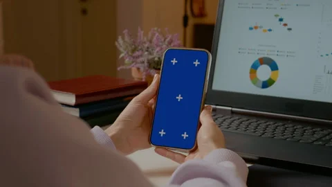 Freelancer holding smartphone with blue screen chroma key Stock Footage 305146310