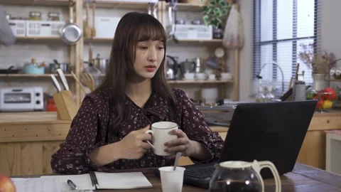 Freelancer with hot coffee in hands is drinking Video stock 158103961