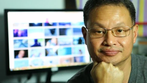 Freelancer  looking camera in his house, Thailand Stock Footage 102094134