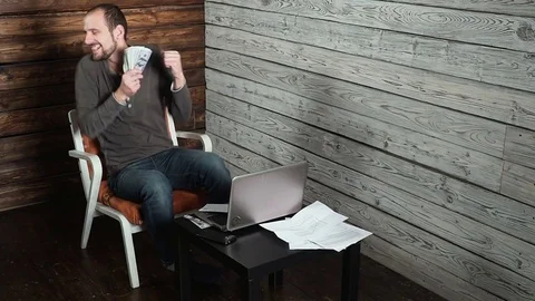 Freelancer man has happy mail with money dollars and Contract Stock Footage 82441400