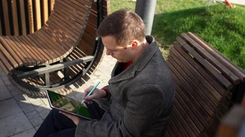 Freelancer man sings contract with electronic signature on tablet computer by Stock Footage 168512011