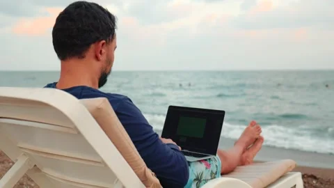 Freelancer man working on laptop and looking after the child. Remote work Stock Footage 204860332