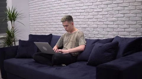 Freelancer man working with laptop, distance studying at home, online lesson Stock Footage 134269319