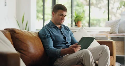 Freelancer, online and man with tablet, home and copywriting on social media app Stock Footage 329343567