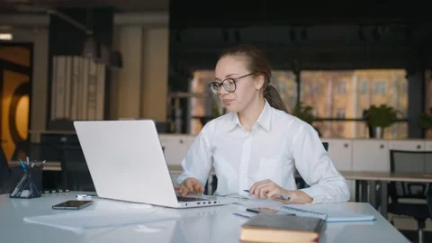 Freelancer online videoconference with clients or colleagues in modern office Stock Footage 145724453