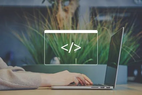 Freelancer person in a cafe is coding on a laptop Stock Photos