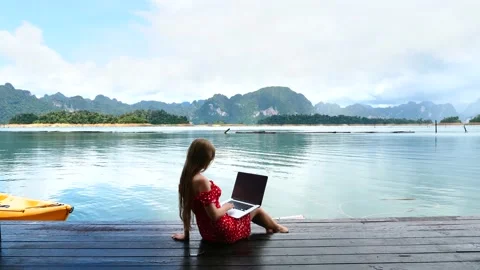 Freelancer Person with Computer Working Online on Morning Lake with Mountains Video stock 147612960