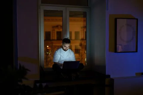 Freelancer programmer work on laptop late at night. Web developer coding 写真素材