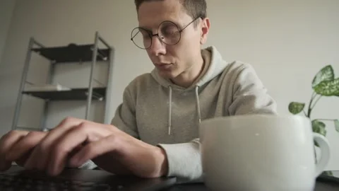 Freelancer programmer working at home at day , writing code on computer, hacker Stock Footage 309205178