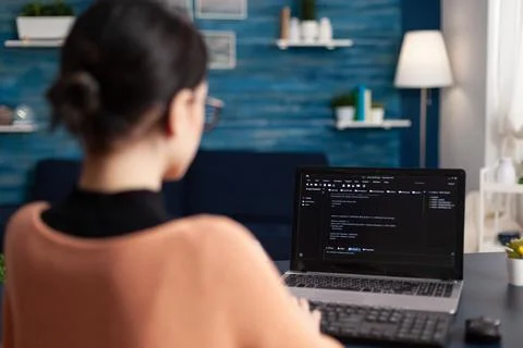 Freelancer programming software on laptop. Stock Photos