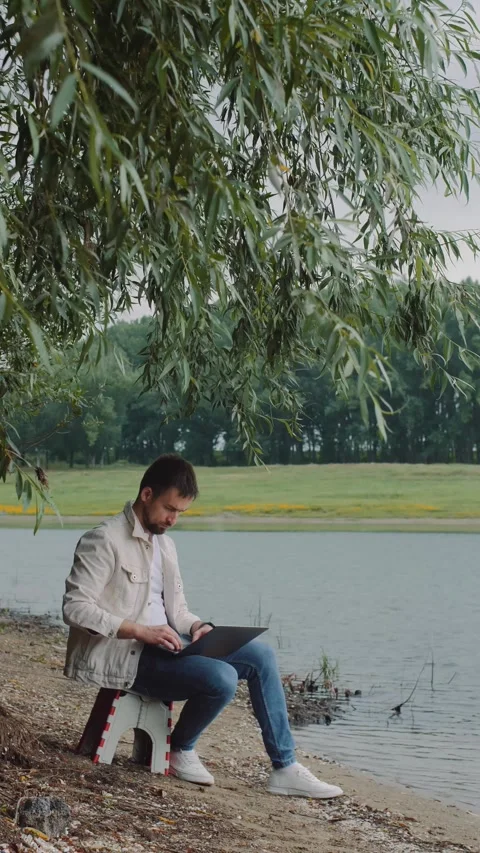 Freelancer at the river Stock Footage 291716872