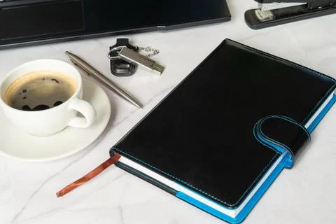 Freelancer Sets Up Environment With Notebooks And Coffee Essentials Stock Photos