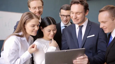 Freelancer showing indicators to his group on laptop Stock Footage 130042673