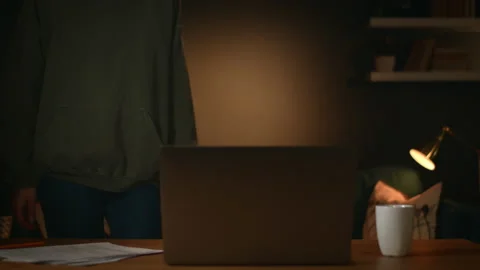 Freelancer sits down at the table and start work, girl works from home Stock Footage 147247073