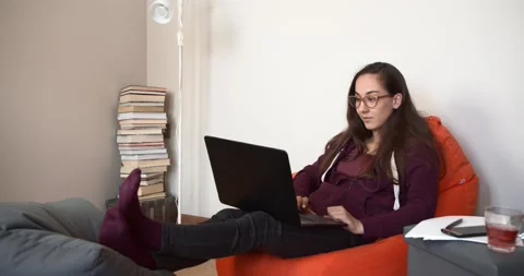 The freelancer talks to the client via a laptop via video link. Work from home Stock Footage 132251249