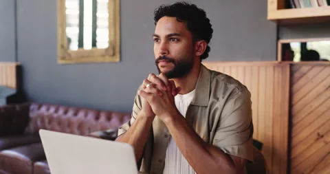 Freelancer, thinking and man with laptop in restaurant for remote work, Stock Footage 330040388