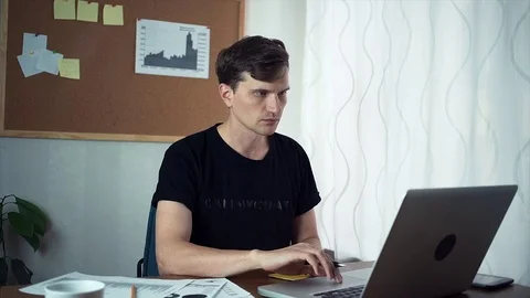 Freelancer using laptop computer in the home office Stock Footage 79895578