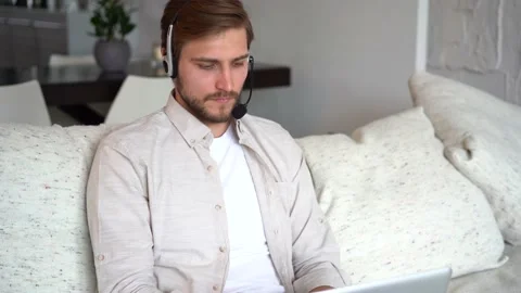 Freelancer using laptop device leaning on sofa, entrepreneur working distantly Stock Footage 154796800