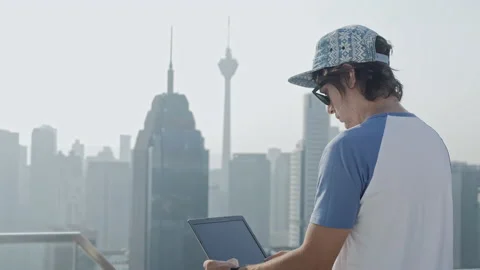 Freelancer using laptop on modern city background. Stock Footage 85980118
