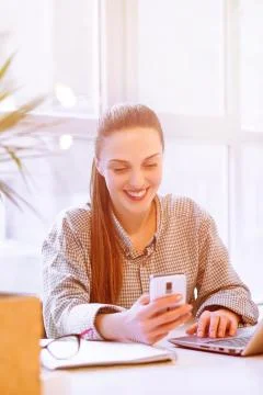 Freelancer using phone Stock Photos