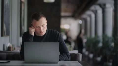 Freelancer Web-Developer Or Architect Working Online With Laptop Sitting In Cafe Stock Footage 248510358