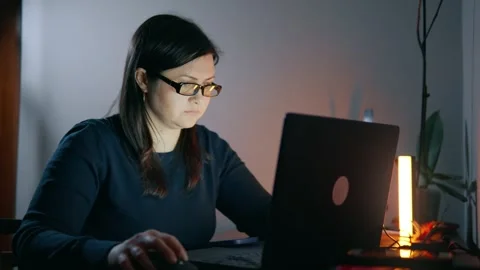 Freelancer woman using computer to learn how to work on the internet at home. Stock Footage 240344586