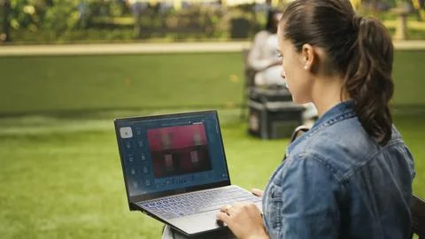 Freelancer woman using text to image AI tool for generating content Stock Photos
