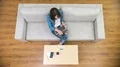 The freelancer woman work with a laptop on the sofa. Time lapse 4k or 4k+ Resolution