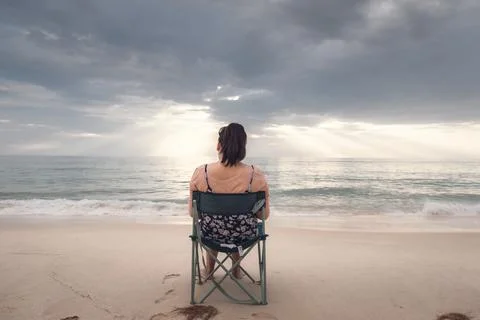 Freelancer Woman is Working on Tablet While Travel Vacation Trip at The Beach Stock Photos