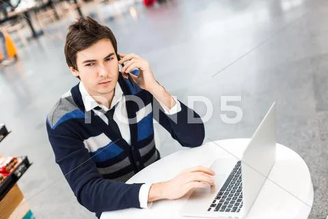 Freelancer Work On Computer And Talking By Phone