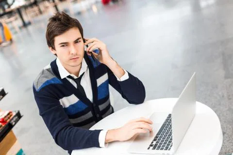 Freelancer work on computer and talking by phone Foto stock