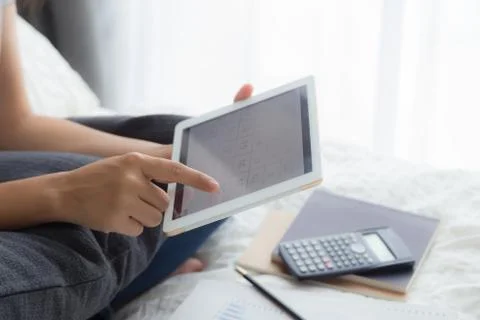 Freelancer work at home, using tablet, calendar apps. Stock Photos