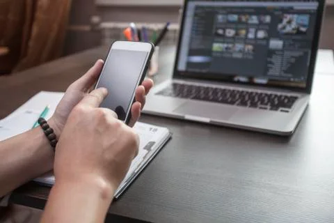 The freelancer at work with phone Stock Photos