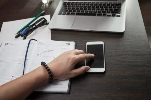 The freelancer at work with phone Stock Photos