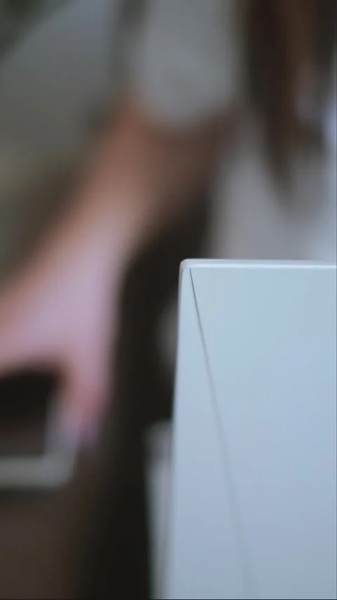 A freelancer working from home on a laptop, close-up of hands on the keyboard, w Stock Footage 276183109
