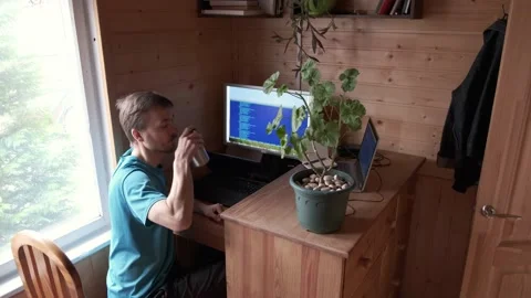 Freelancer working from home in self-isolation, drinks water and goes to kitchen Video stock 130494218