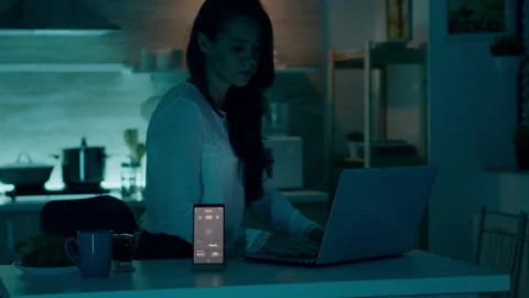 Freelancer working from home turning on lights using voice command Stock Footage 152880582