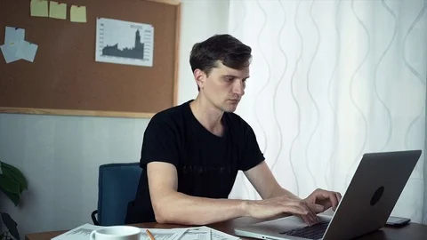Freelancer working on laptop computer in the home office Stock Footage 79894714
