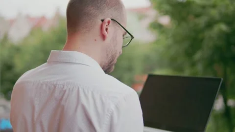Freelancer working on laptop outdoors Stock Footage 159902827