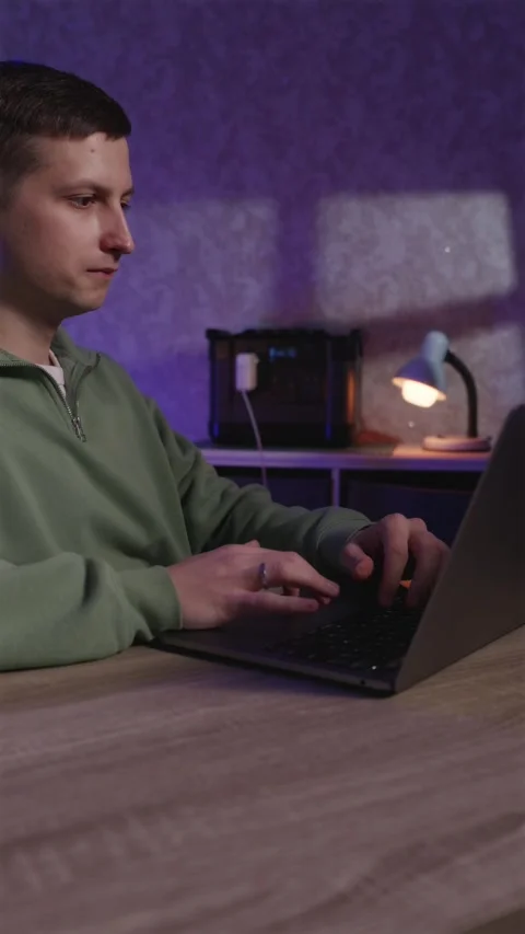 Freelancer working at night using portable backup power station Stock Footage 334732347