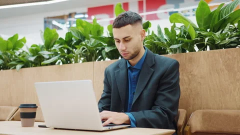Freelancer working remotely in cafe looking at camera Stock Footage 172163547