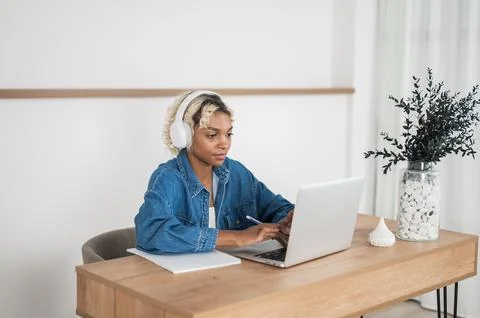 Freelancer working remotely from her home or college student studying at home Stock Photos
