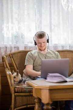 Freelancer working remotely from home using laptop and thinking problem solution Stock Photos
